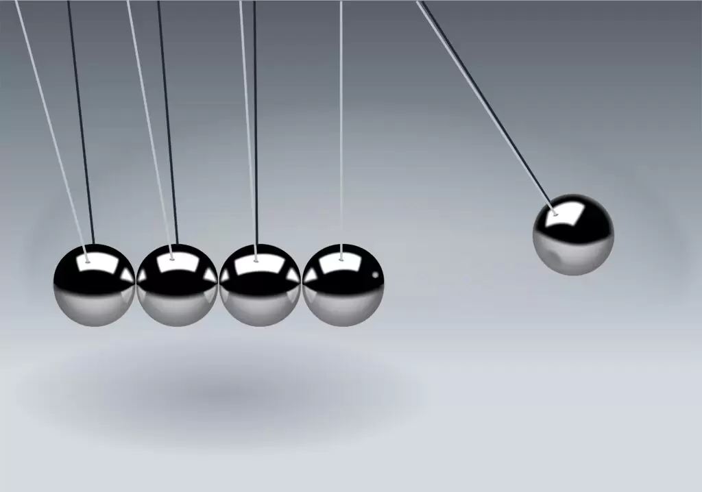 From Motion to Momentum Dynamic illustration of Newton's Cradle showing motion and reflection concepts in physics.